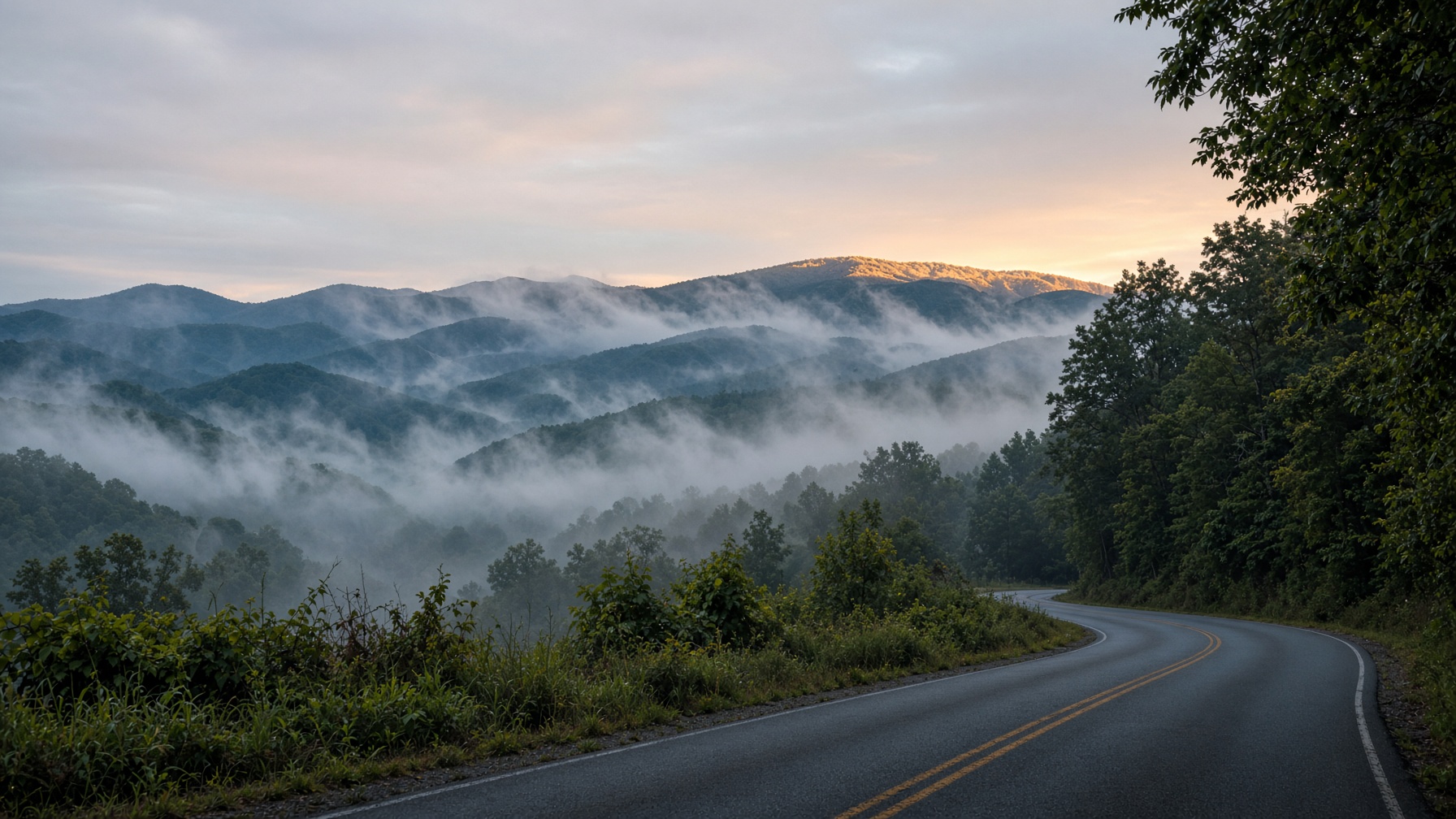 Fog in the ridges along a two-lane road in the Western North Carolina mountains.